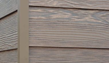 Caribou Trails RusticSeries wood-look composite siding on James Hardie fiber cement lap siding
