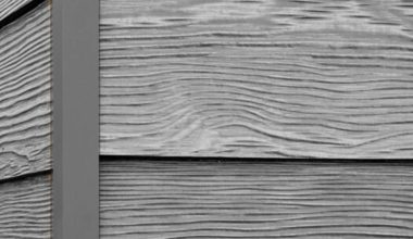 Cascade Slate RusticSeries wood-look composite siding on James Hardie fiber cement lap siding