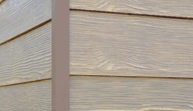 Sand Castle RusticSeries wood-look composite siding on James Hardie fiber cement lap siding